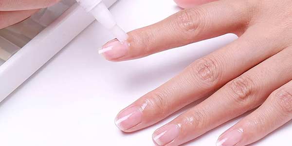 Cuticle oil application at the end of a manicure