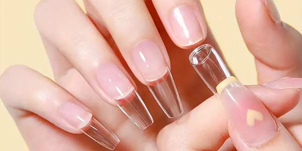 Clear nail tips used with solid tape gel